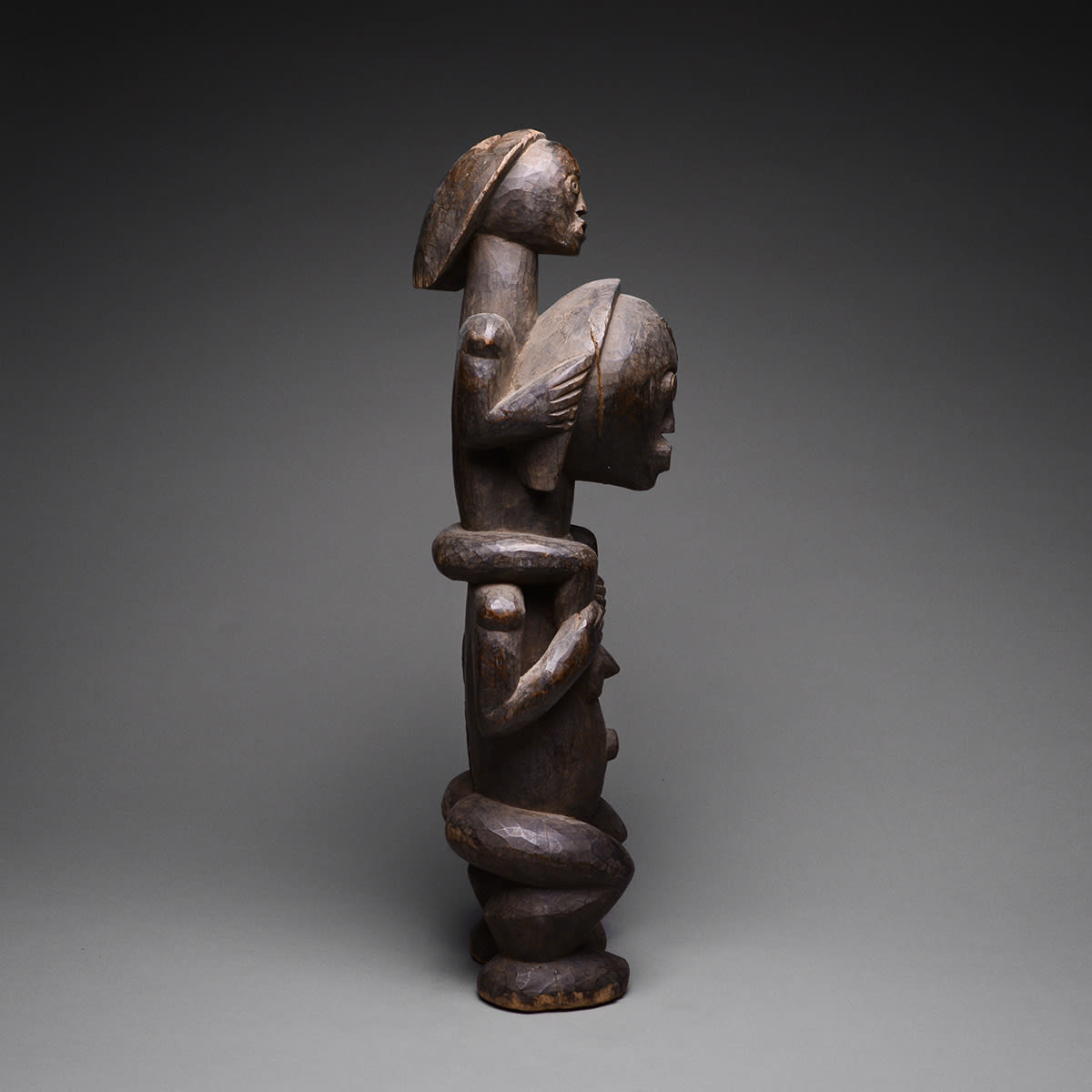 Fang Mother Carrying a Child, 20th Century CE