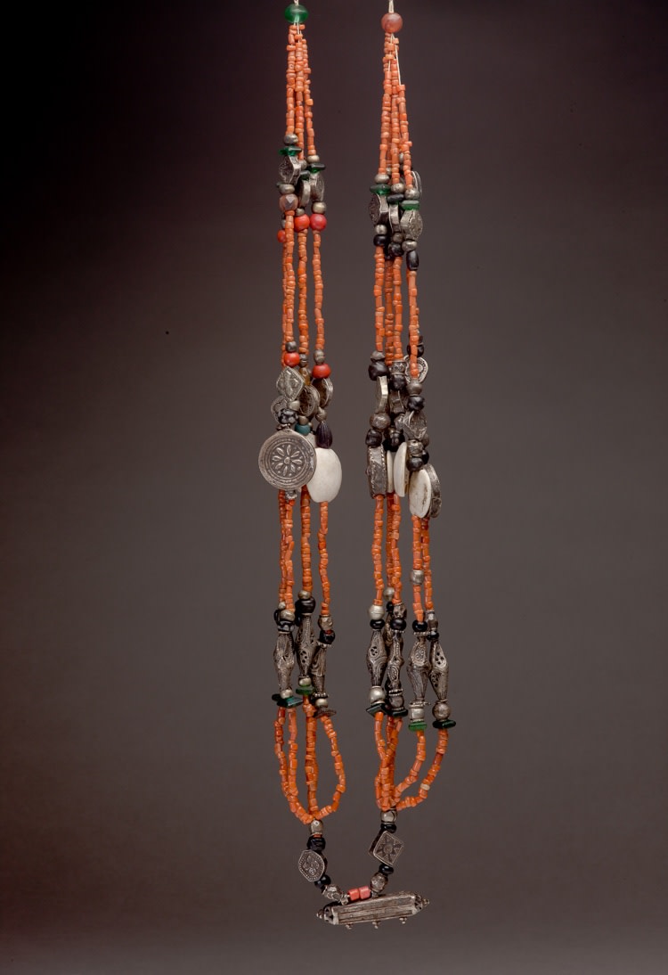 Coral necklace with amulet case and numerous diverse other elements