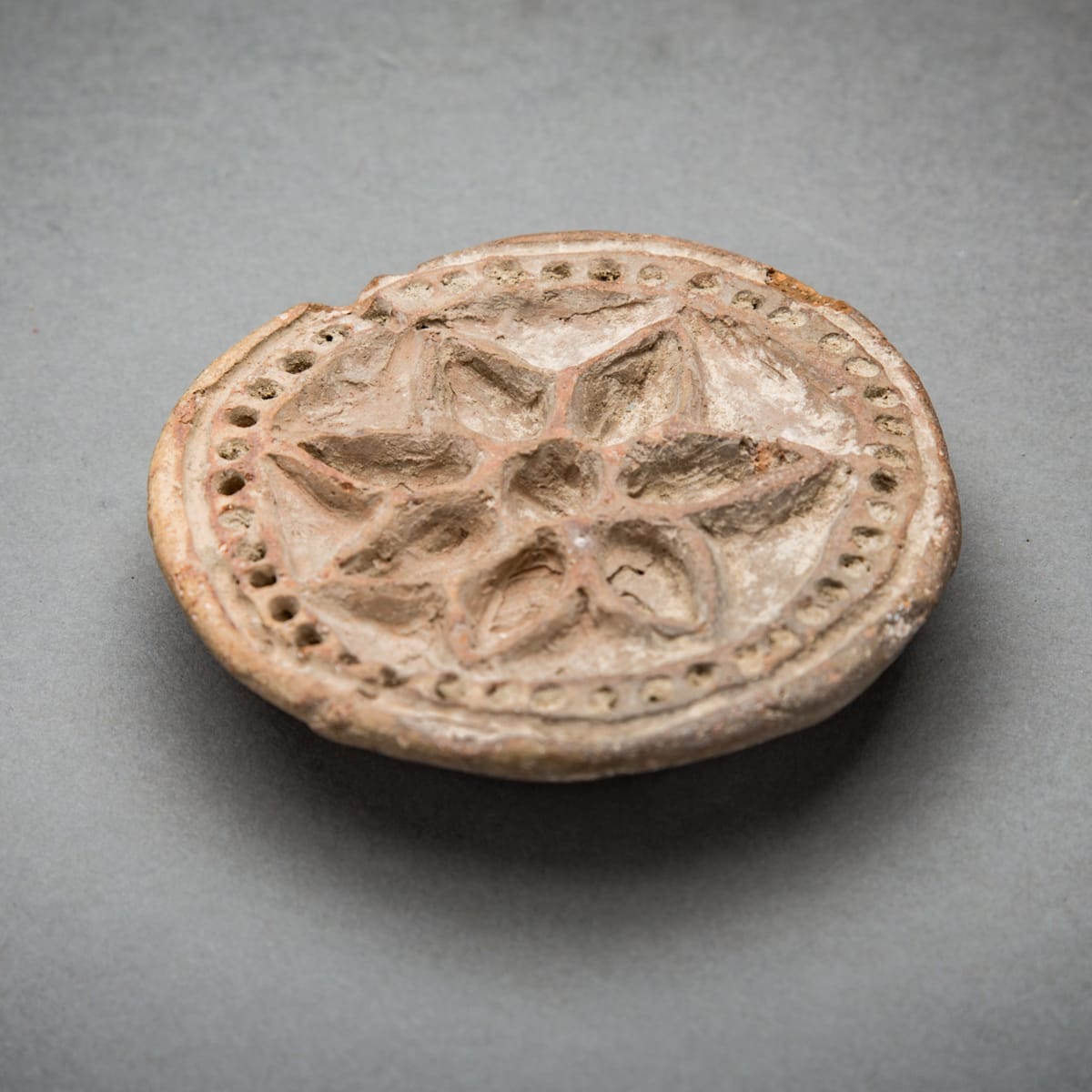 Terracotta Moulded Stamp, 800 CE - 1200 CE
