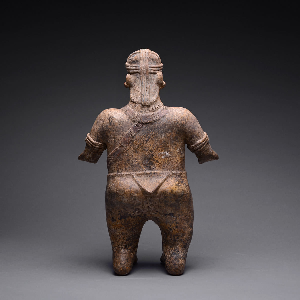 El Arenal Brown Style Jalisco Terracotta Sculpture of a Man Wearing a Helmet, 300 BCE - 300 CE