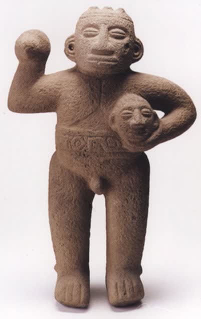 Basalt Standing Male Figure Holding Trophy Head, 500 CE - 1000 CE