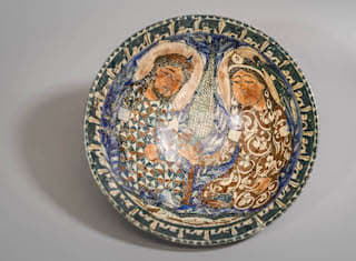 Round deep bowl decorated by central figural scene, 13th Century CE - 14th Century CE