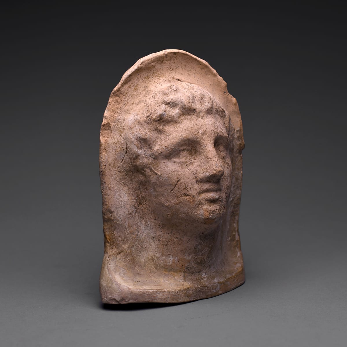 An Etruscan Terracotta Votive Head of a Youthful Man, 4th Century BC to 3rd Century BC