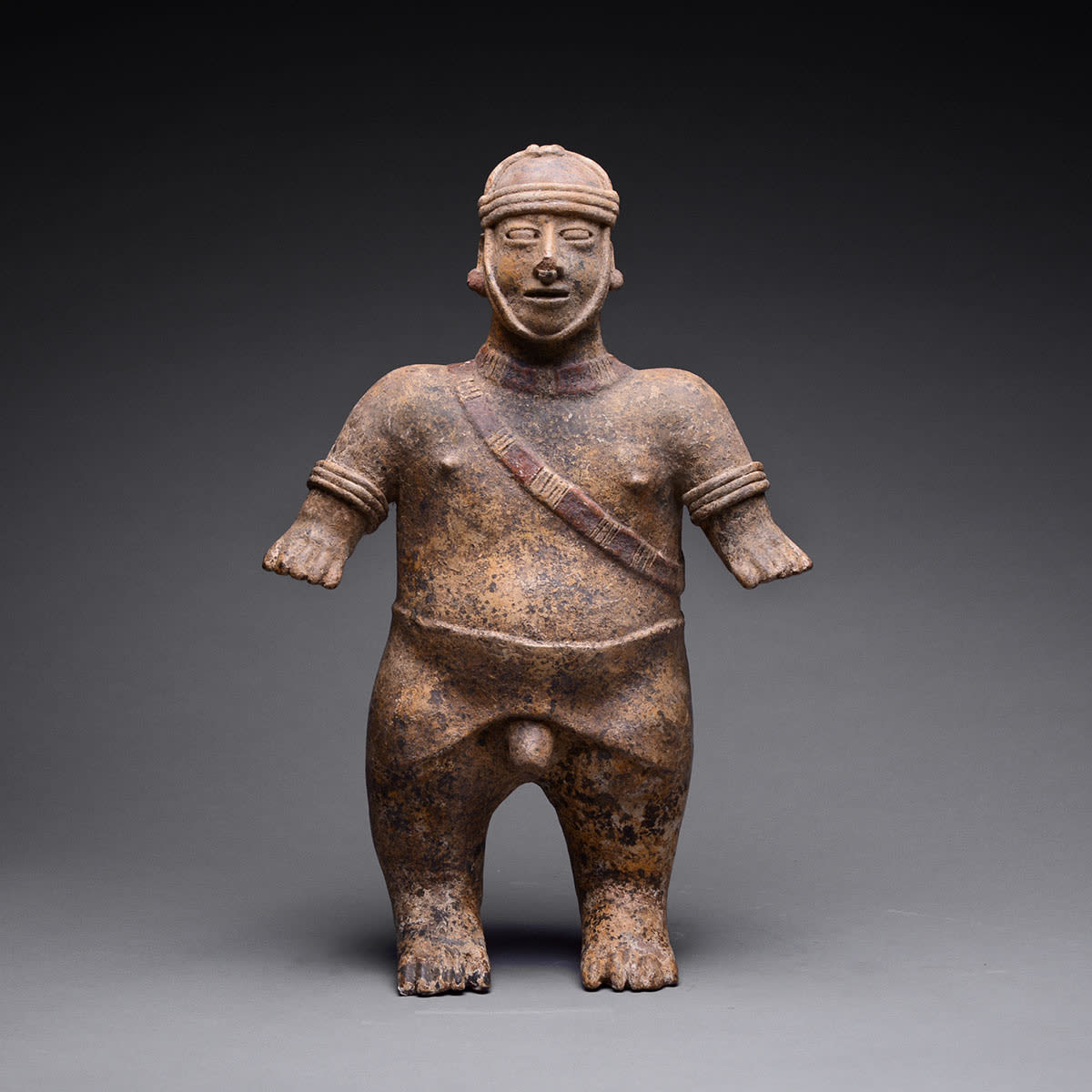 El Arenal Brown Style Jalisco Terracotta Sculpture of a Man Wearing a Helmet, 300 BCE - 300 CE