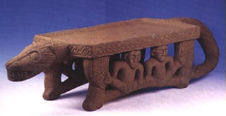 Basalt Metate in the Form of a Jaguar with Human Figure Seated in Between the Legs, 700 CE - 1000 CE