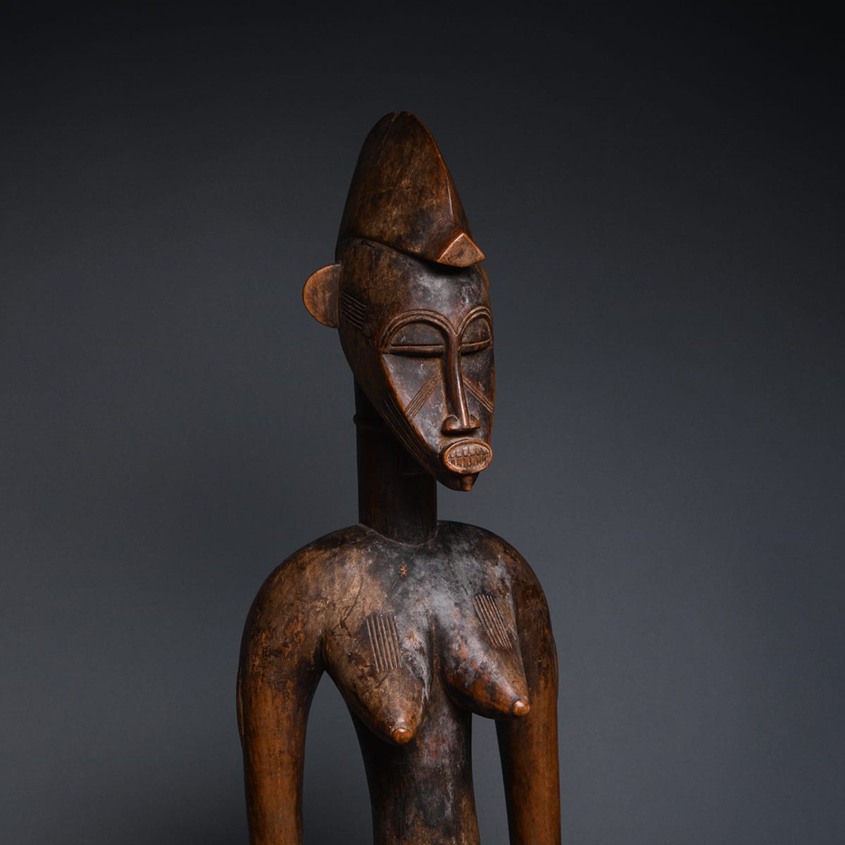 Female Senufo Wooden Pombilele Rhythm Pounder, 20th Century CE