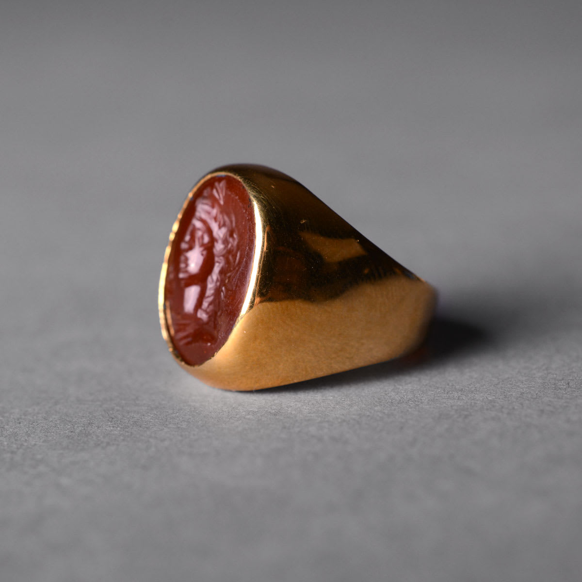 Gold Ring Featuring a Roman Carnelian Intaglio Depicting an Emperor, 1st Century CE - 2nd Century CE