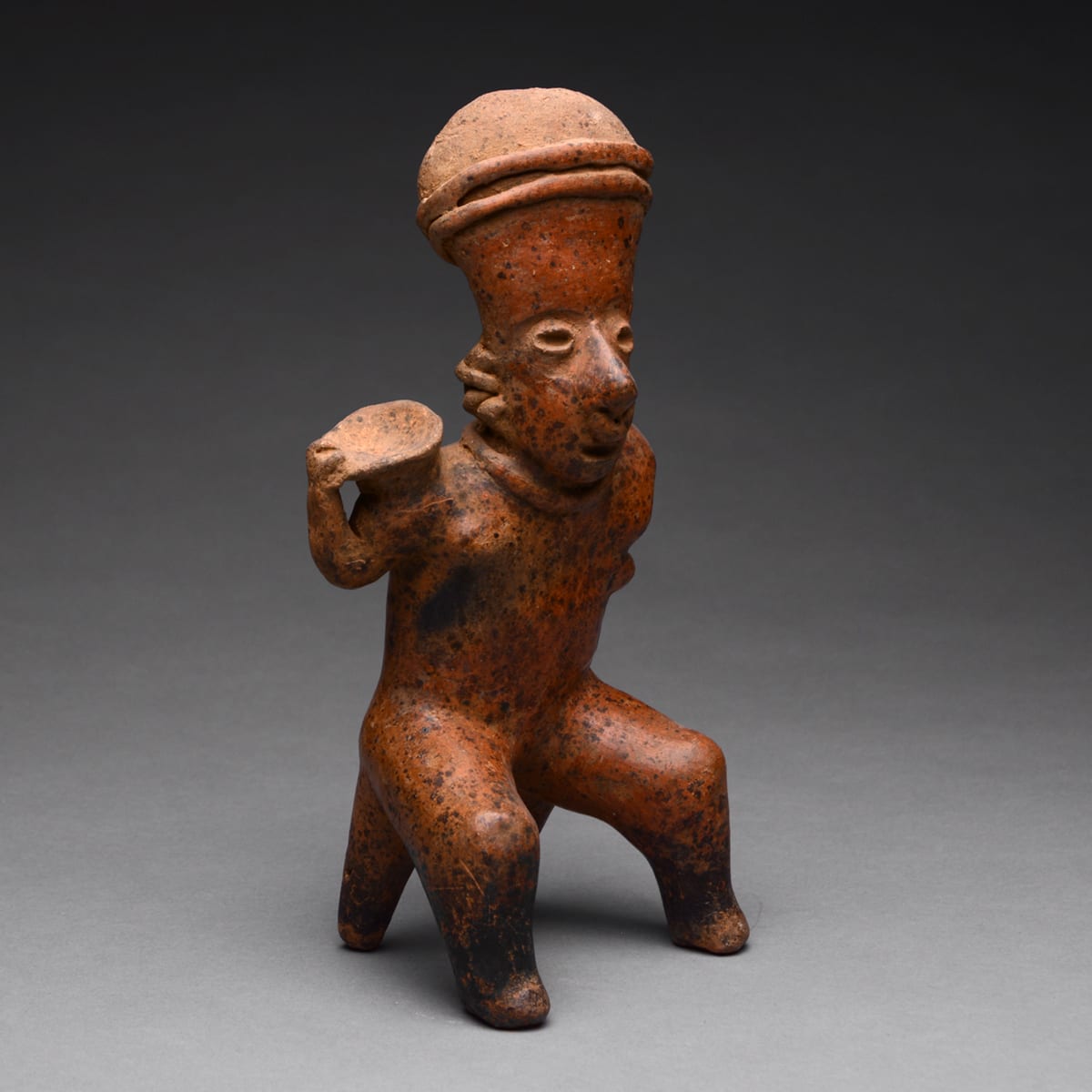 San Sebastián Style Nayarit Sculpture of Seated Woman Holding an Offering Bowl, 300 BCE - 300 CE