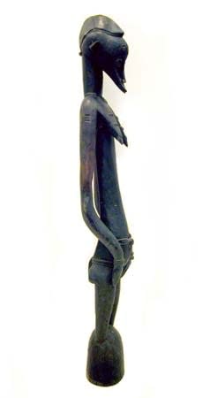 Female Senufo Wooden Pombilele Rhythm Pounder, 20th Century CE