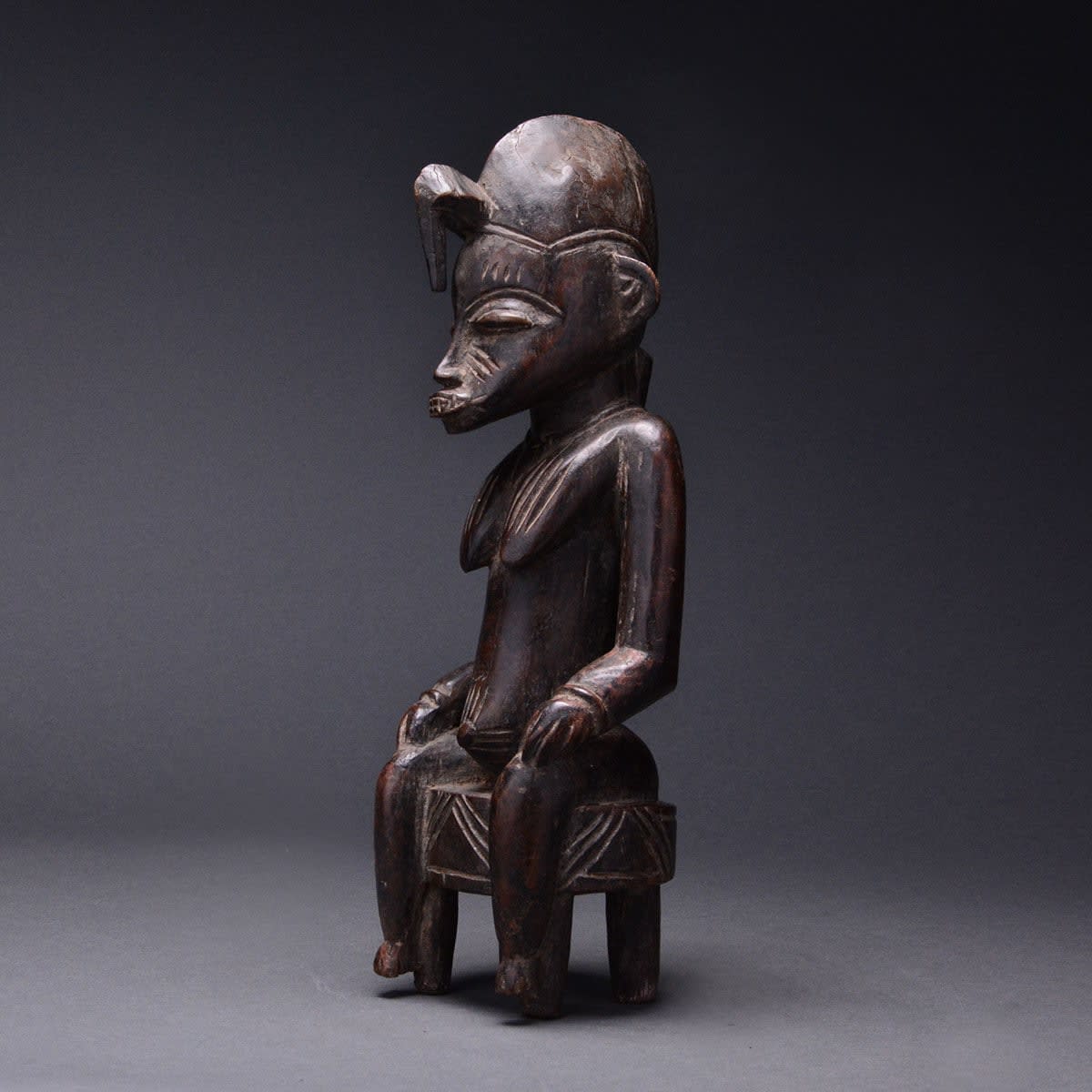 Senufo Wooden Sculpture of a Seated Woman, 20th Century CE