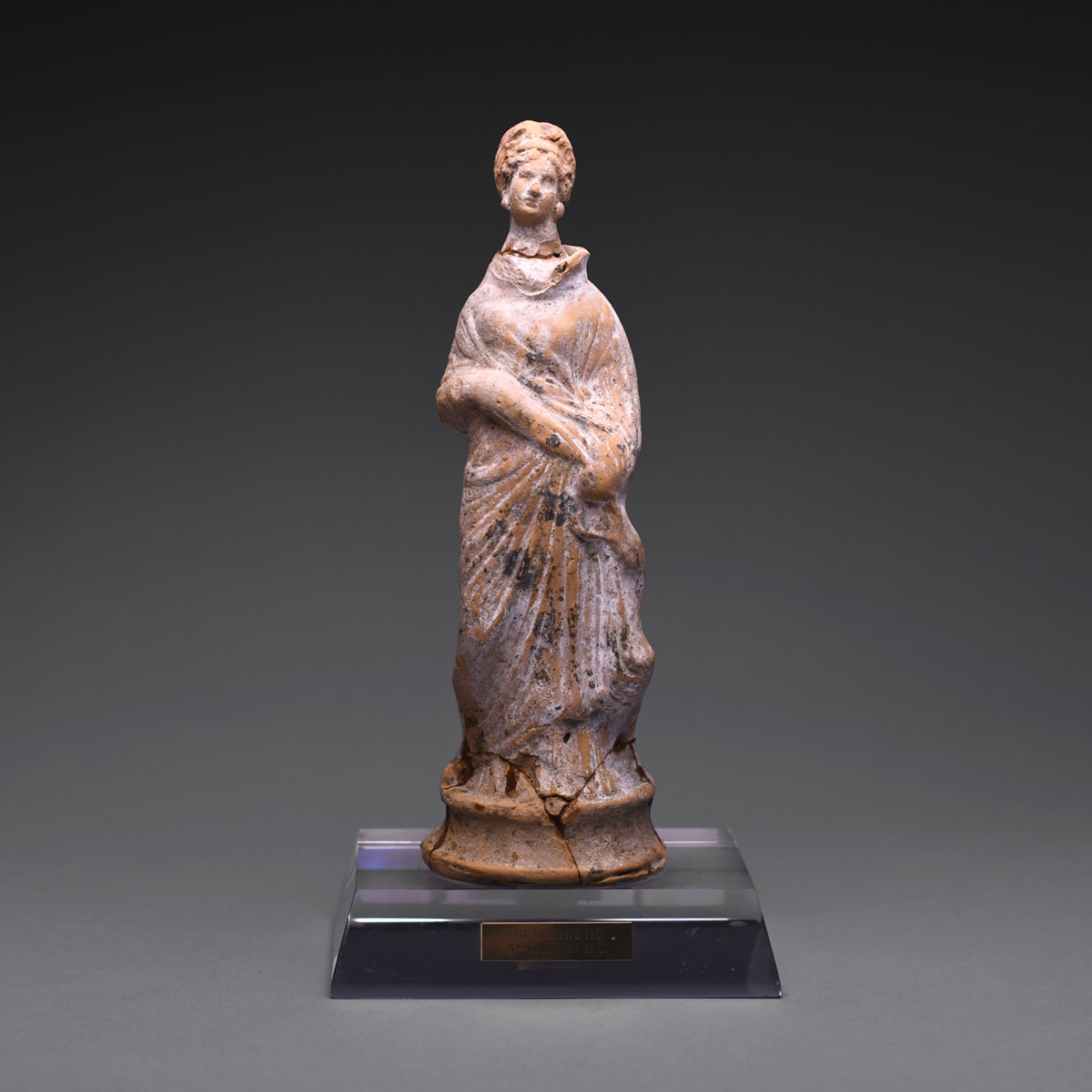A Hellenistic Terracotta Statue of a Standing Woman, 3rd Century BC