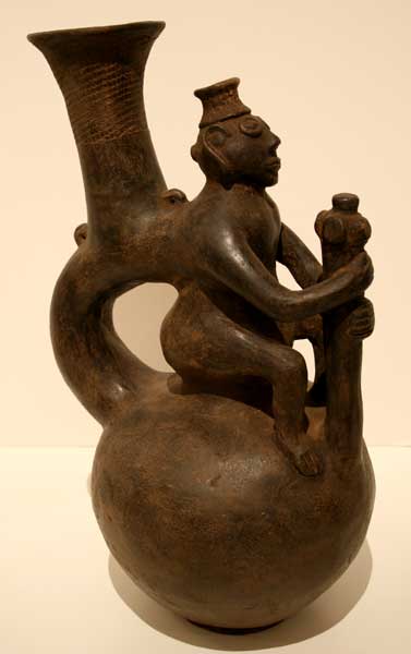 Terracotta Vessel Featuring a Seated Man Holding a Mace, 19th Century CE - 20th Century CE