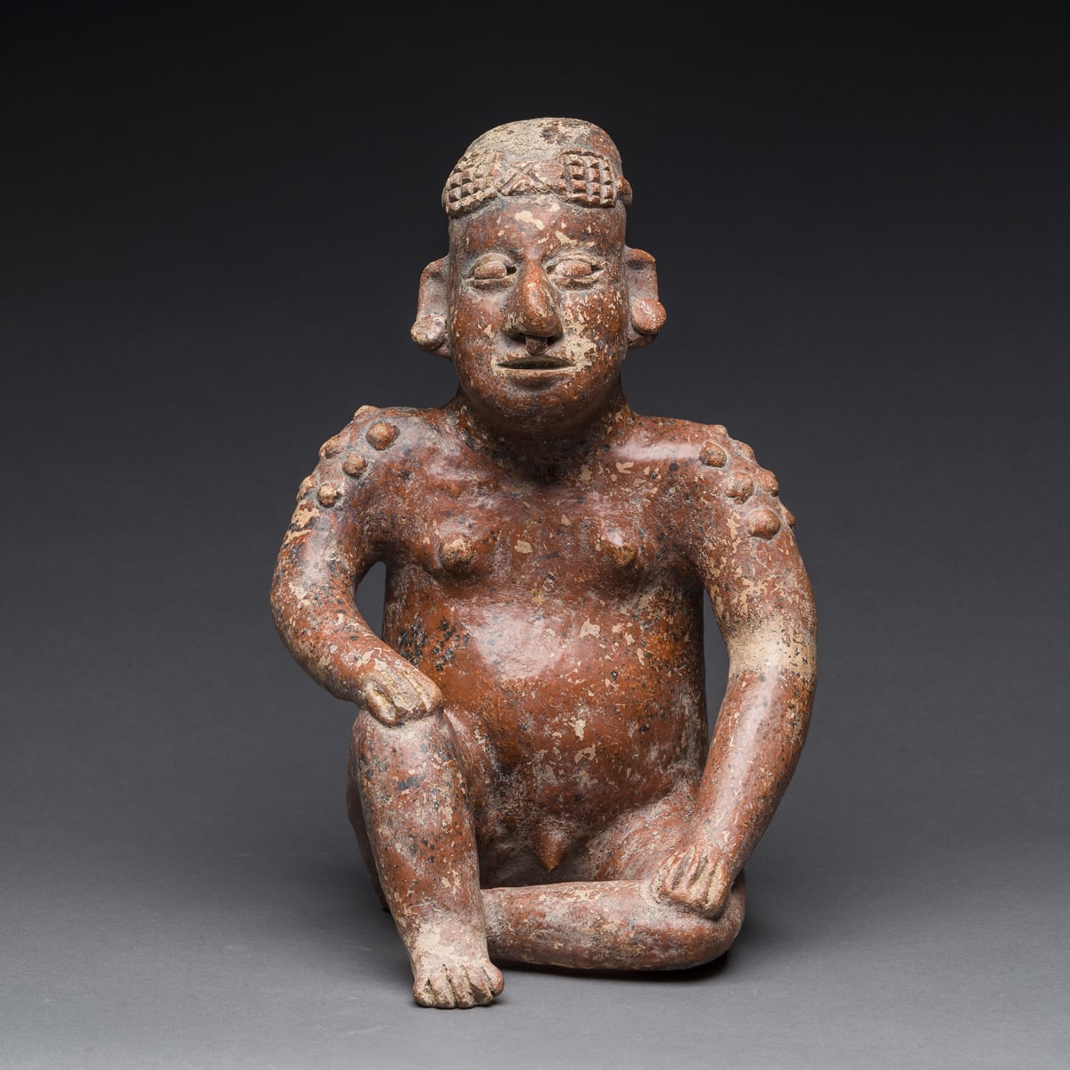 El Arenal Brown Style Jalisco Terracotta Sculpture of a Seated Man, 300 BCE - 300 CE