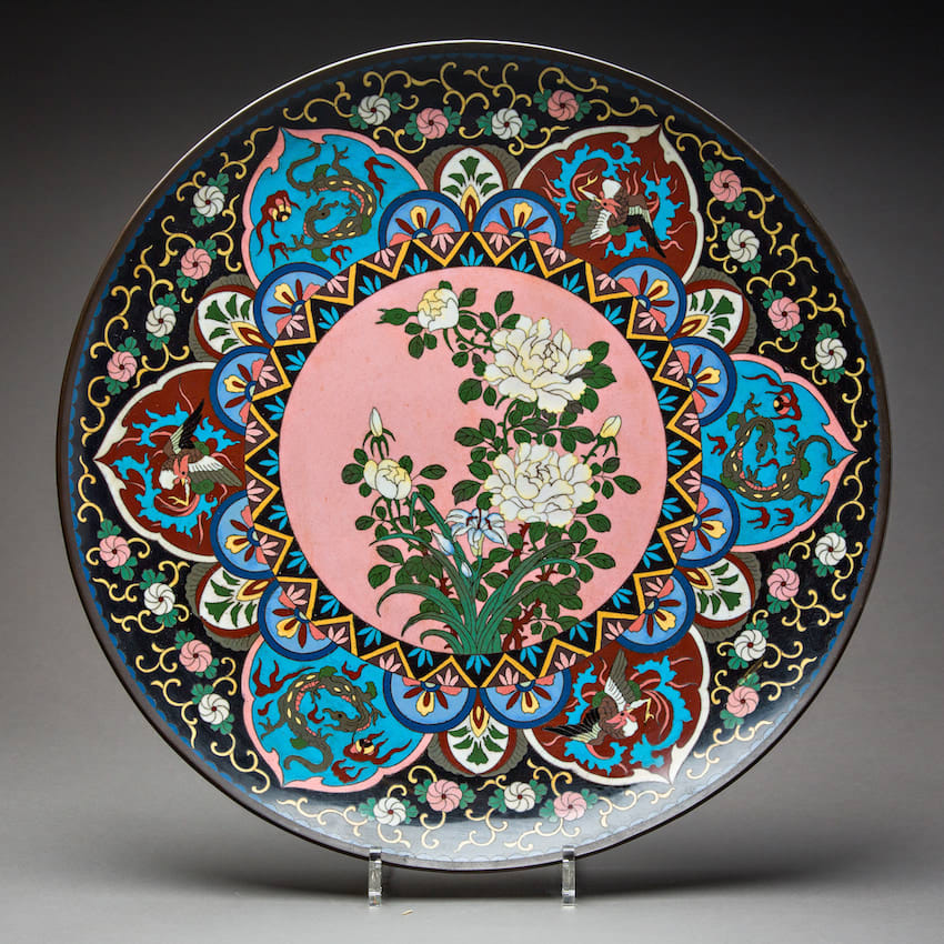 Large cloisonné plate with curving lip and floral decoration