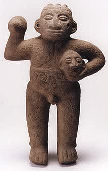 Basalt Standing Male Figure Holding Trophy Head, 500 CE - 1000 CE