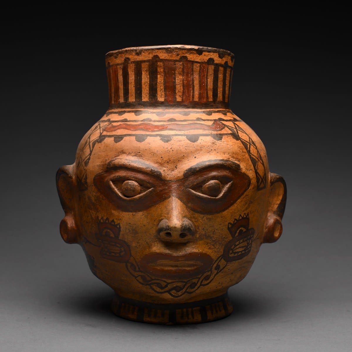 Terracotta Polychrome Trophy Head, 500 CE - 1000 CE
