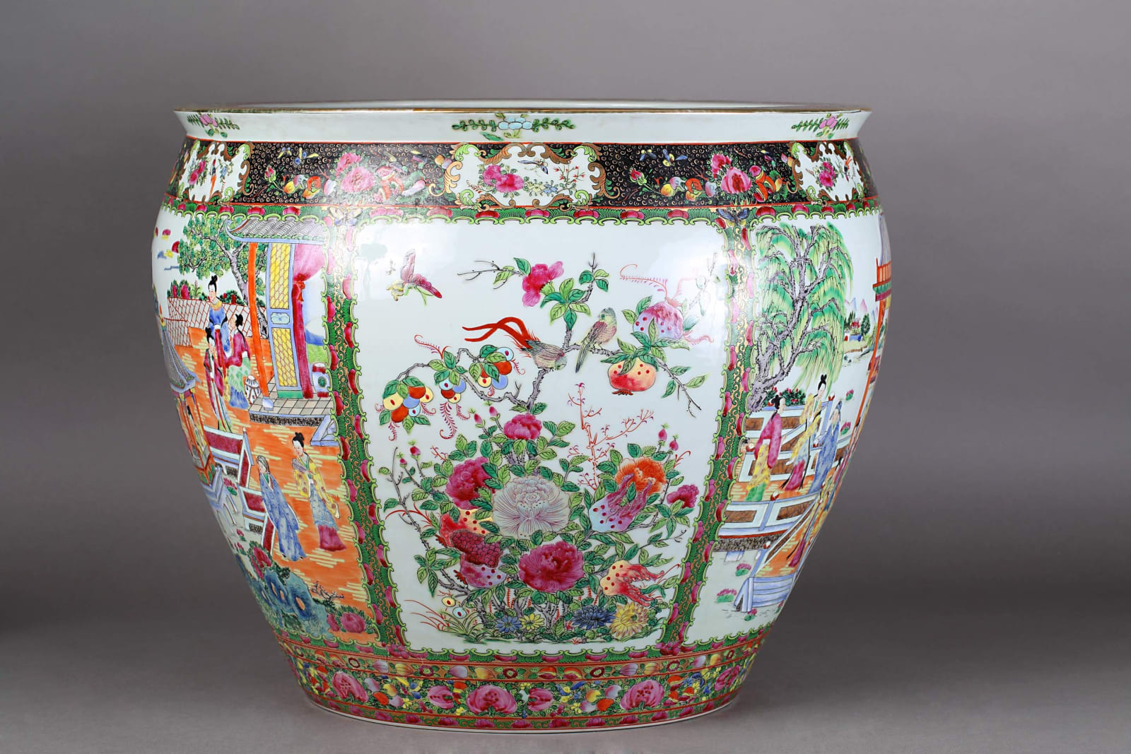 Large porcelain cache pot with floral and figurative motifs