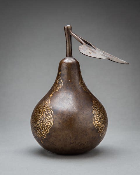 Qajar period steel model of a pear inlaid with gold