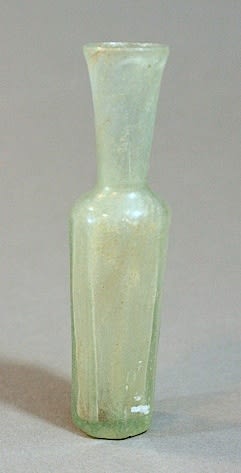 A small wheel cut clear glass bottle with faceted body and neck., 8th Century CE - 11th Century CE