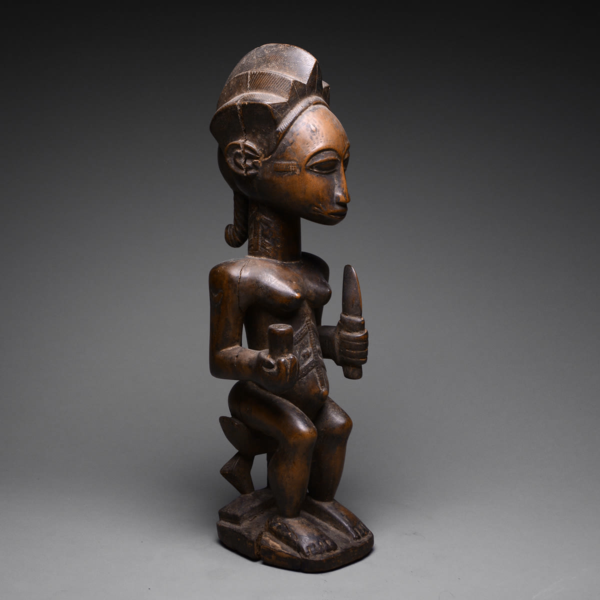 Baule Wooden Sculpture of a Seated Woman, 20th Century CE