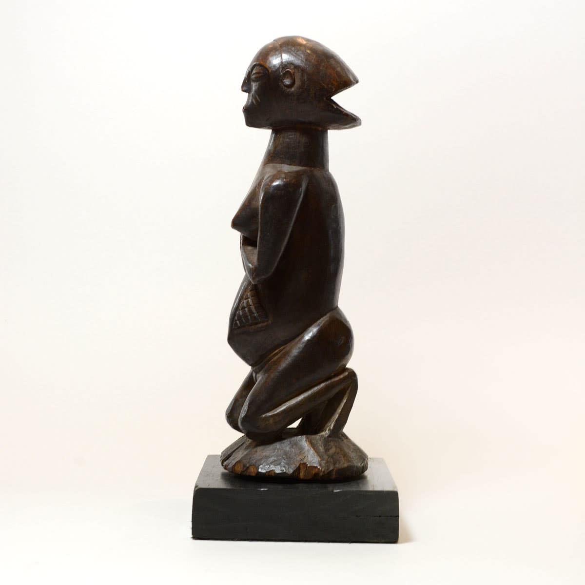 Shankadi Wooden Sculpture of a Kneeling Woman, 20th Century CE