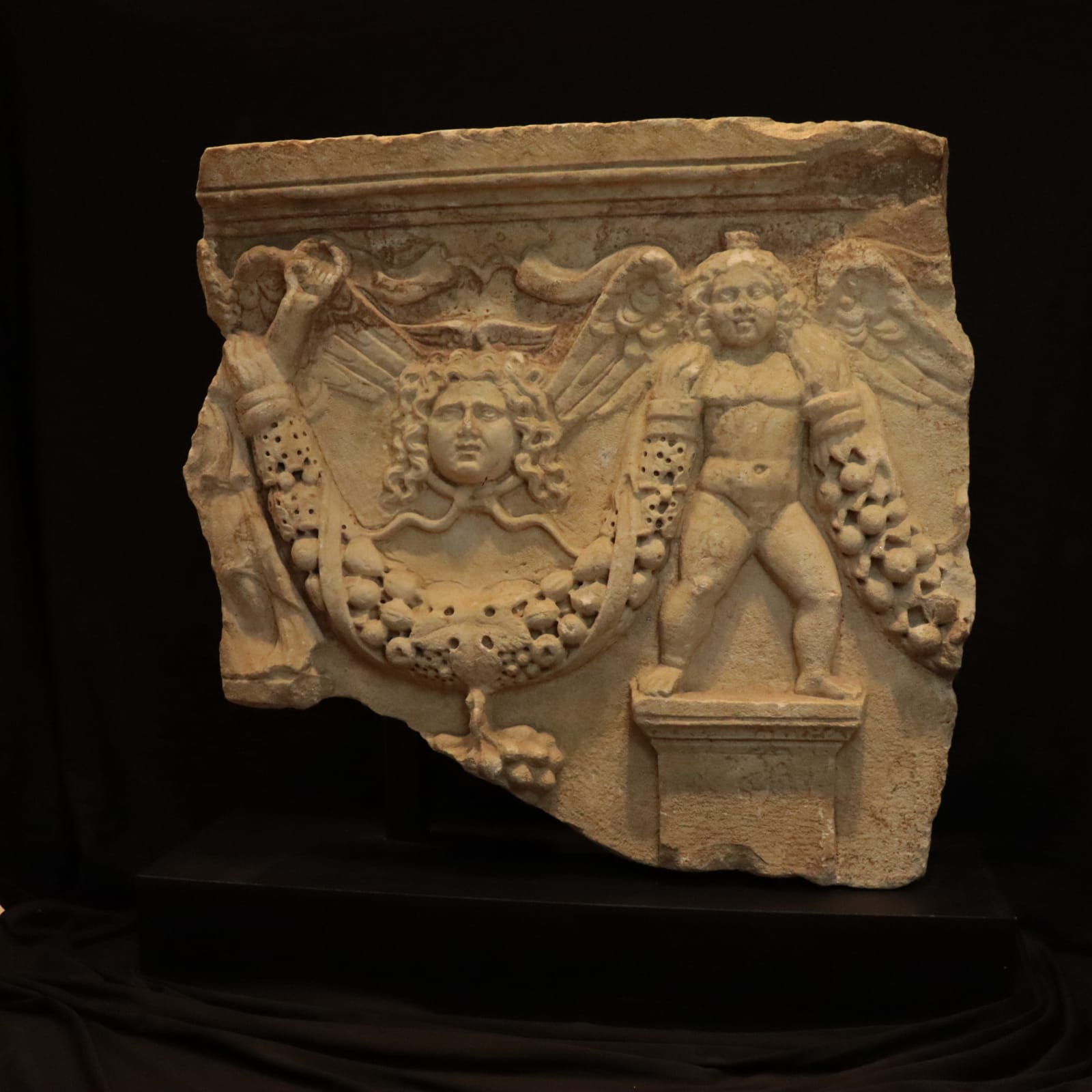 Roman marble fragment of a garland sarcophagus, 2nd Century CE