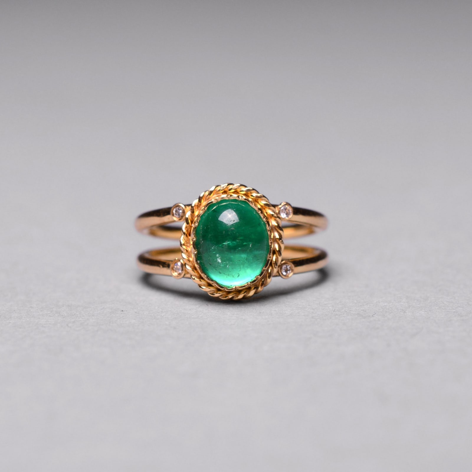 Gold Ring Featuring an Emerald with Four Small Diamonds, 21st Century CE
