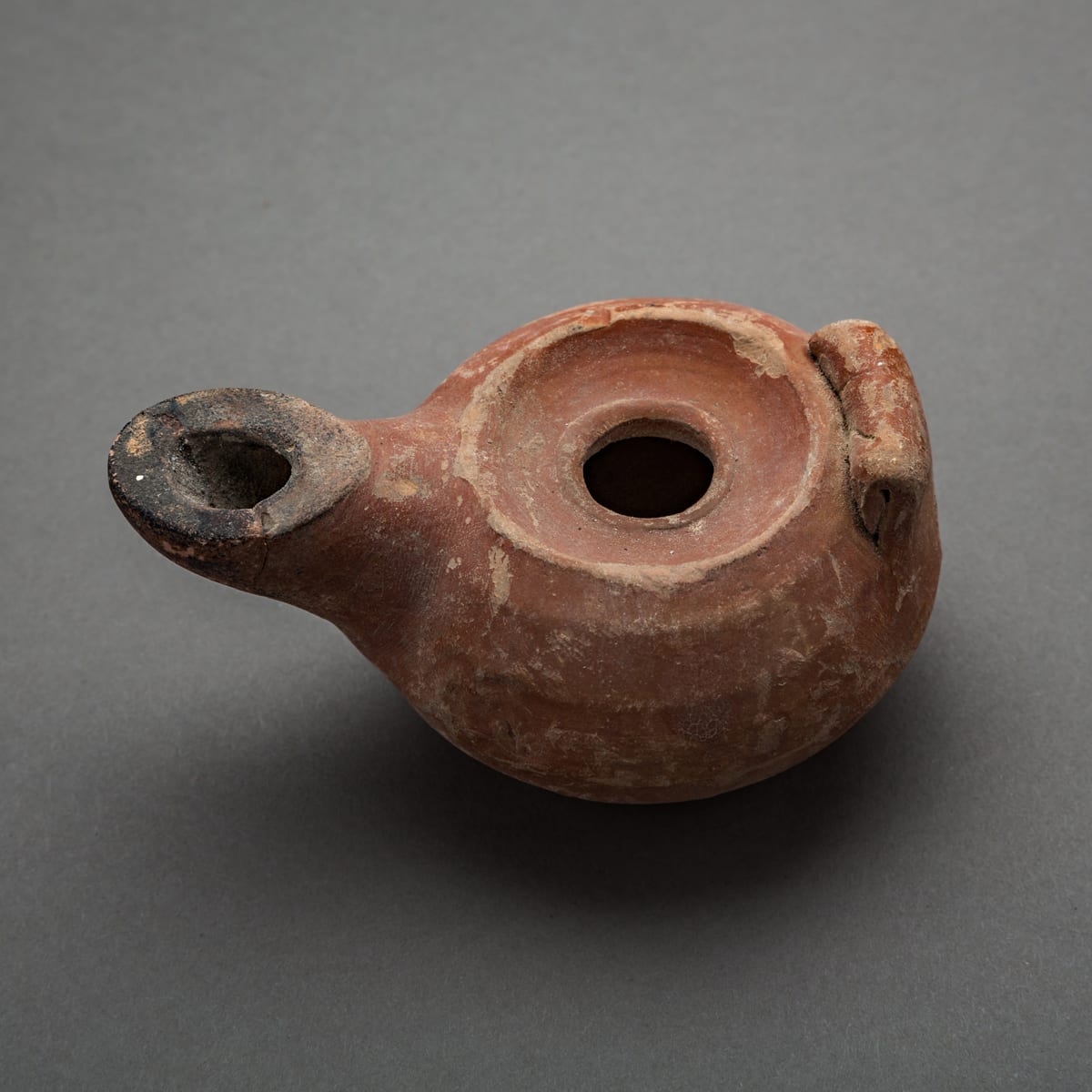 Hellenistic Oil Lamp with Handle, 300 BCE - 100 BCE