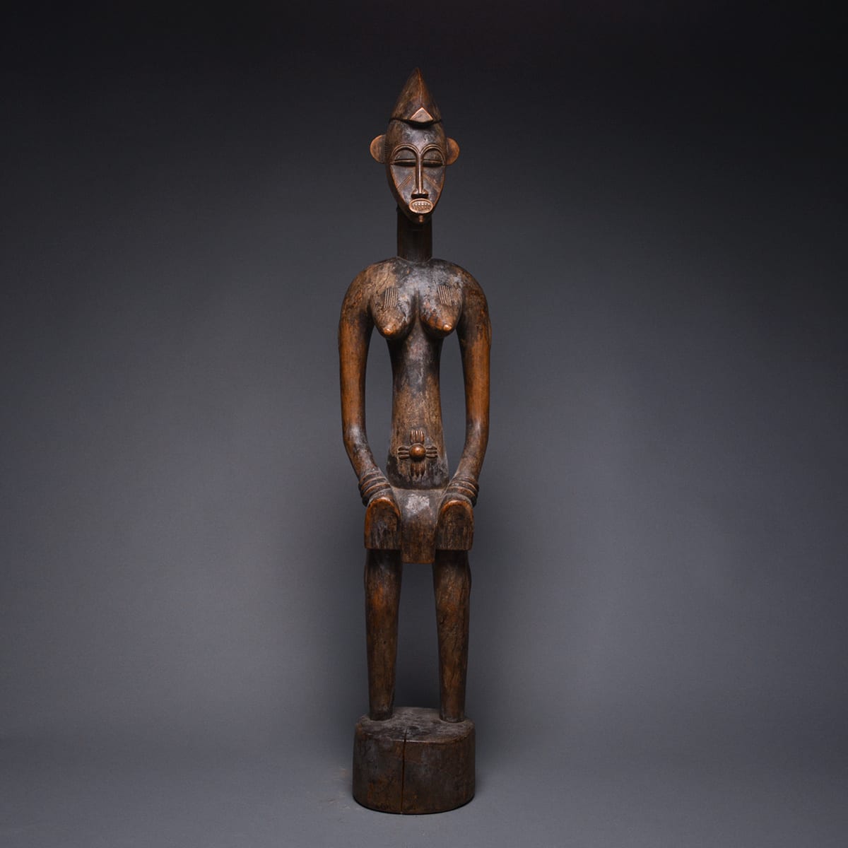 Female Senufo Wooden Pombilele Rhythm Pounder, 20th Century CE