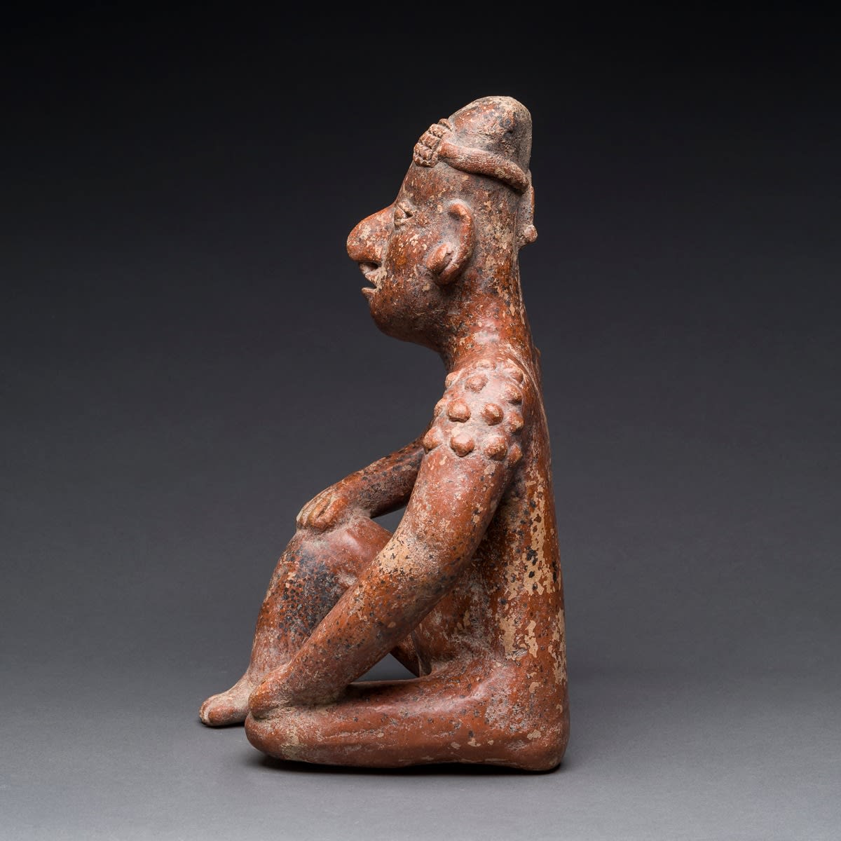 El Arenal Brown Style Jalisco Terracotta Sculpture of a Seated Man, 300 BCE - 300 CE