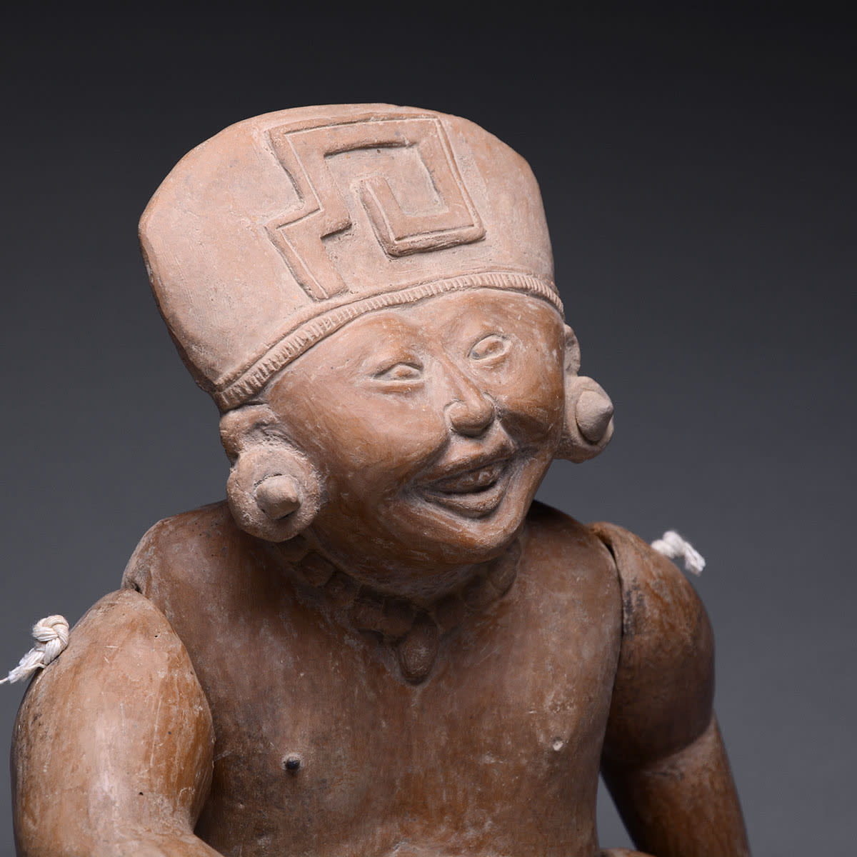 Remojadas Sculpture of a Seated Smiling Child, 600 CE - 900 CE