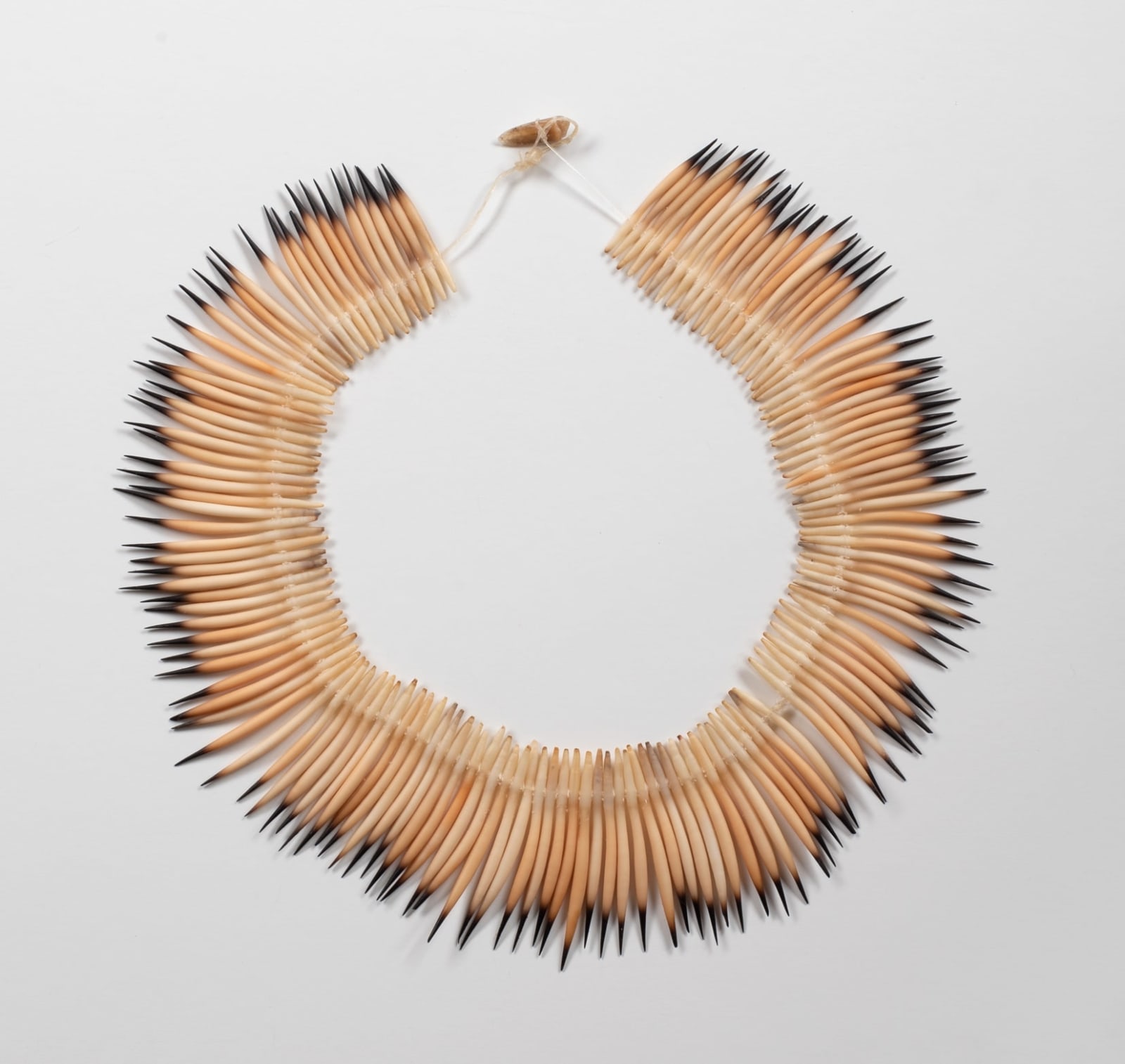 Aunty Jeanette James, palawa necklace - trimanya krakani ta (echidna at rest), 2023