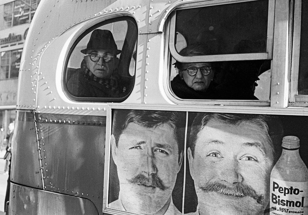 Thomas Hoepker, Billboard and passengers on New York Bus, 1963