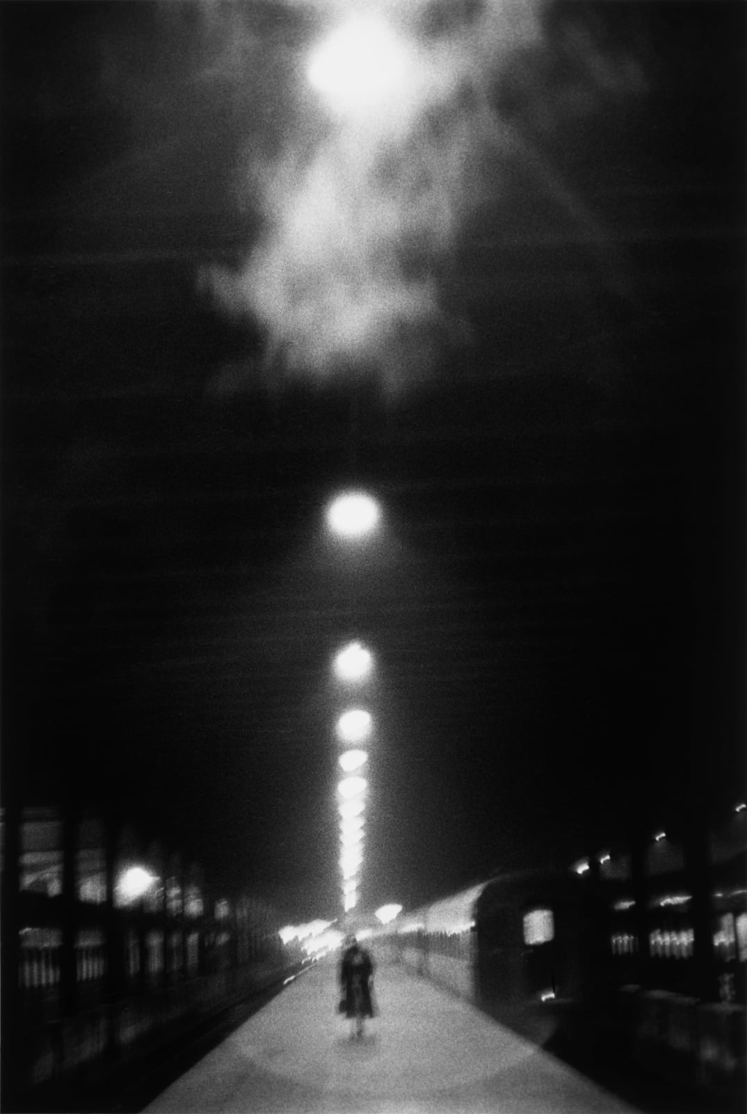 Louis Stettner, Woman on empty platform, Penn Station, New York, 1958