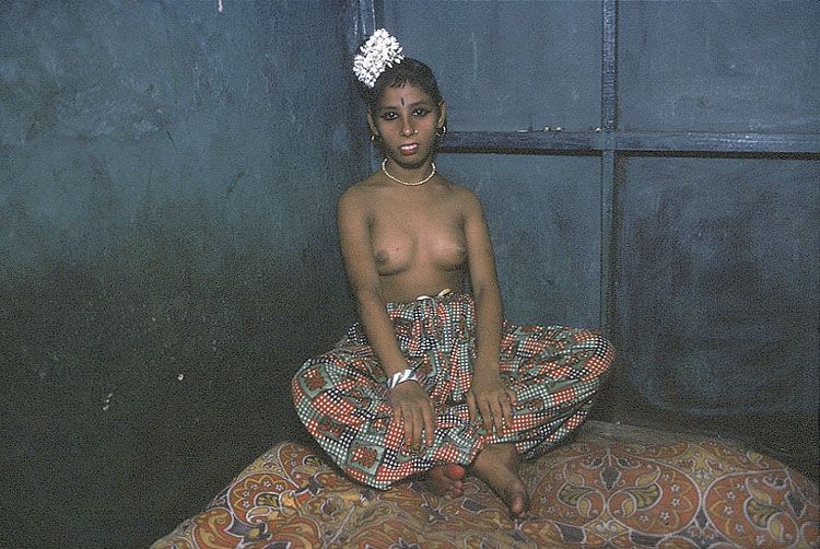 Mary Ellen Mark, Semi-nude Kanta in the Corner of her bed, Bombay, India (from Falkland Road Series), 1978