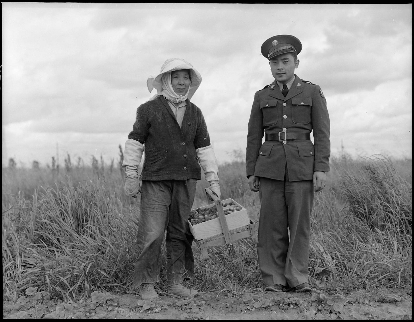 Dorothea Lange, Florin, Sacramento County, California. A soldier and his mother in a strawberry field, 1942