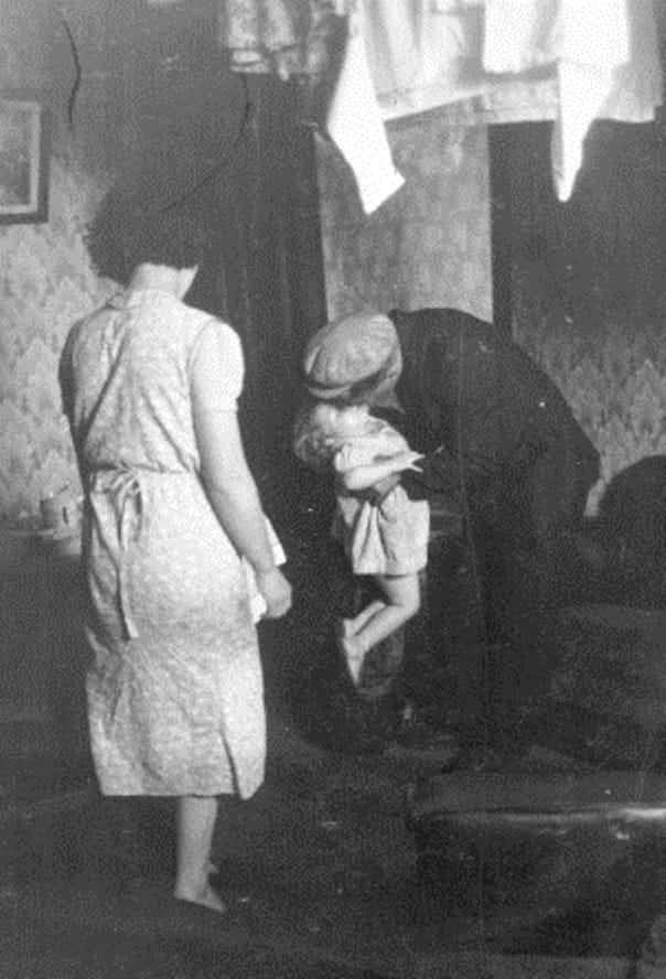 Bert Hardy, Life in the Elephant - Father Kissing Child, 1948