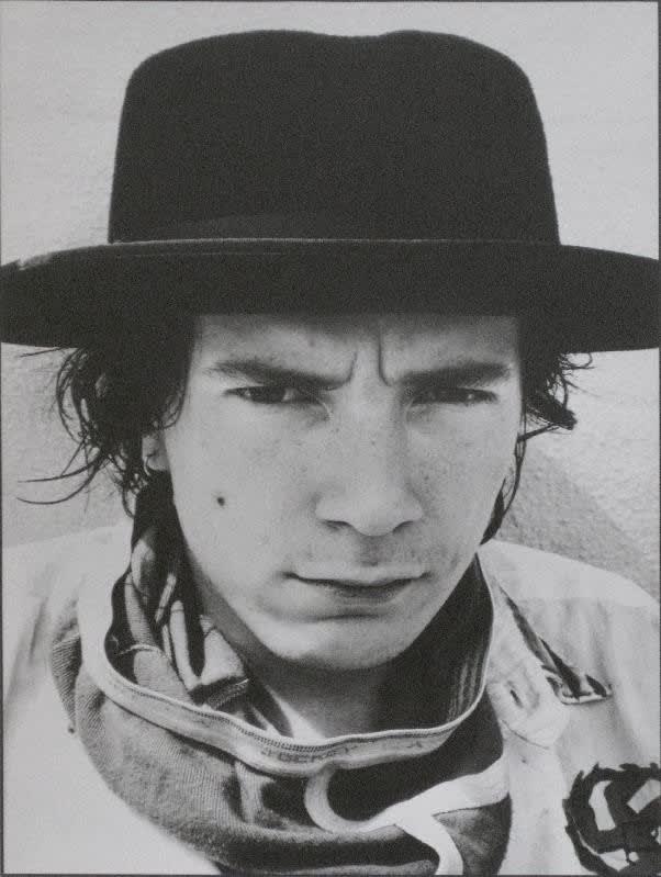 Caroline Coon, Johnny Rotten, lead singer of the SEX PISTOLS, on his roof, 1977
