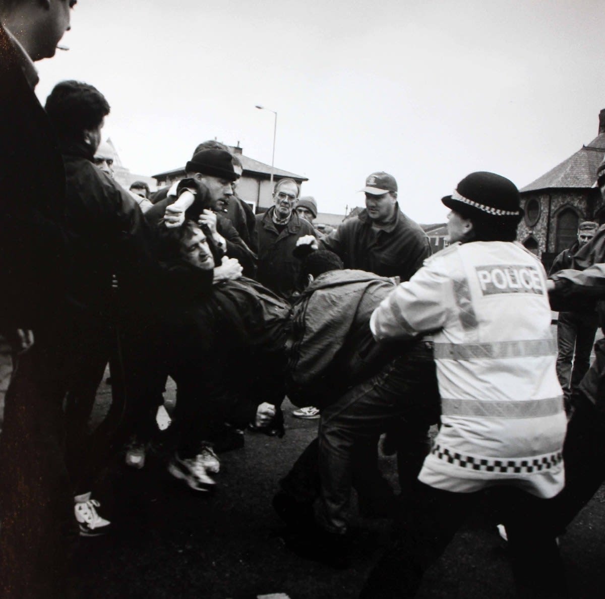Ken Grant, Arrest taking place amongst a football crowd by plain clothed police, c1990
