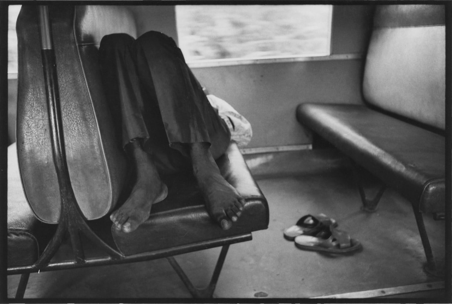Chester Higgins, Weary train traveler, Ghana, 1973