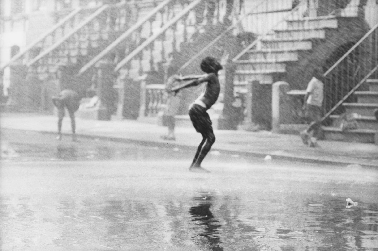 Chester Higgins, Water spray dancer, Harlem, 1969