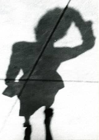 Marvin Newman, Untitled (Blurry shadow of woman holding her head), 1951