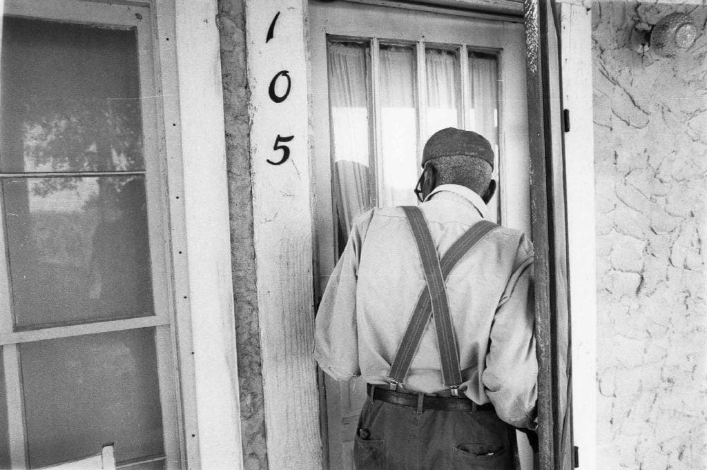 Chester Higgins, Uncle March Fourth McGowan entering his home, New Brockton, Alabama, 1981