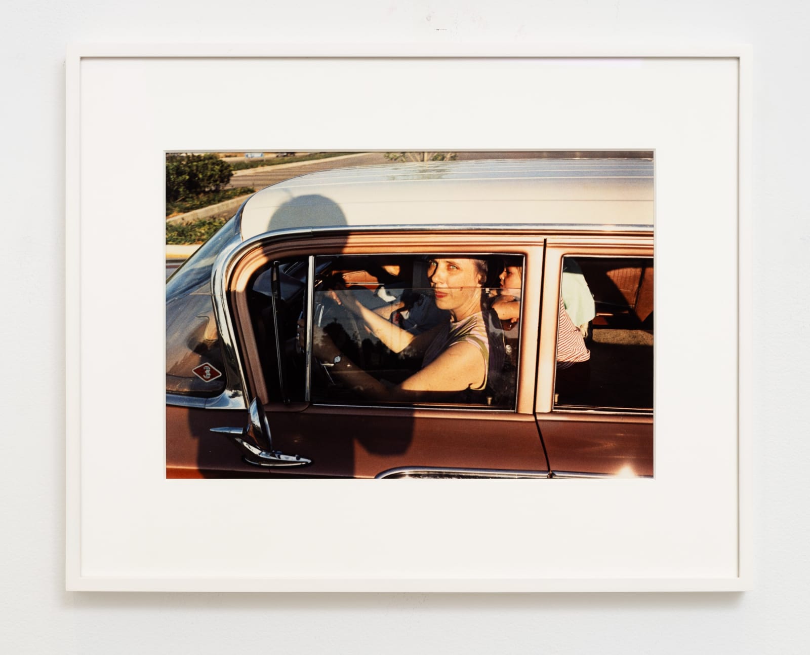 William Eggleston, UNTITLED (WOMAN AND CHILDREN IN PINK CAR) MEMPHIS, TN [FROM DUST BELLS 1], circa 1965-68