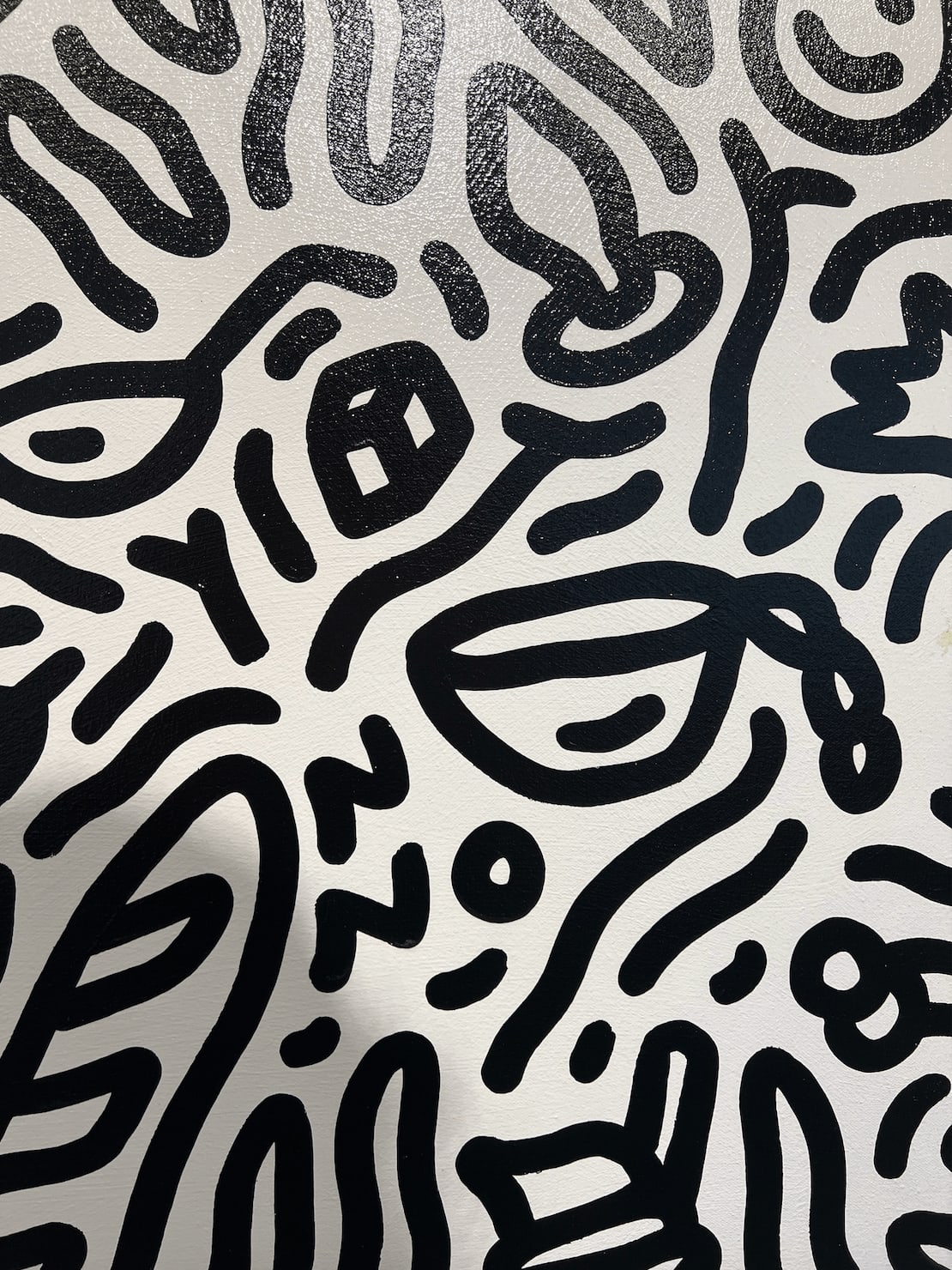 Detail photo of “Day in St. Tropez”, painting by Chance Cooper artist from United States, based in LA. Available at Carousel Fine Art Atlanta. The artist's technique with oil on canvas celebrates the sacred art of storytelling, with each painting evoking the sense of a page torn from one’s life. His work is recognized as a playground where his characters reveal their existential secrets. Colors of this work : Black, White