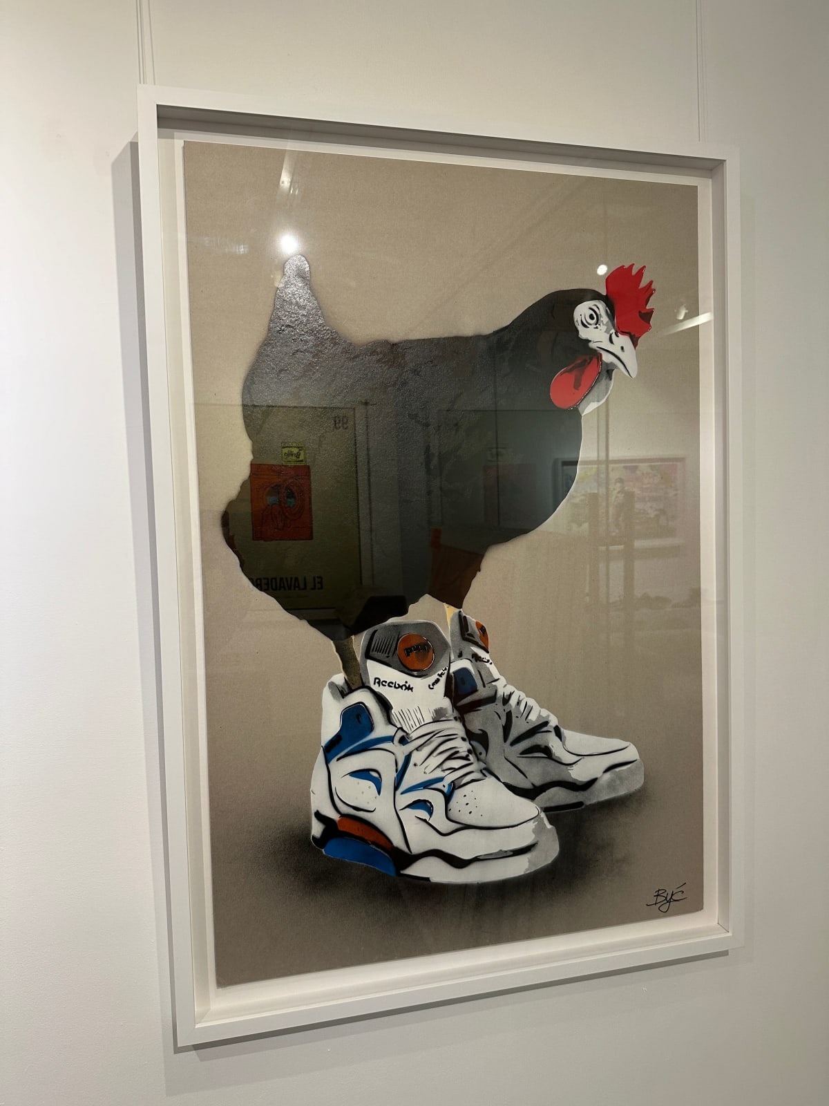 “Chicken at the Top Reebok (Black)”, mixed media work on recycled card stock by BYC artist, from Switzerland. Available at Carousel Fine Art Atlanta