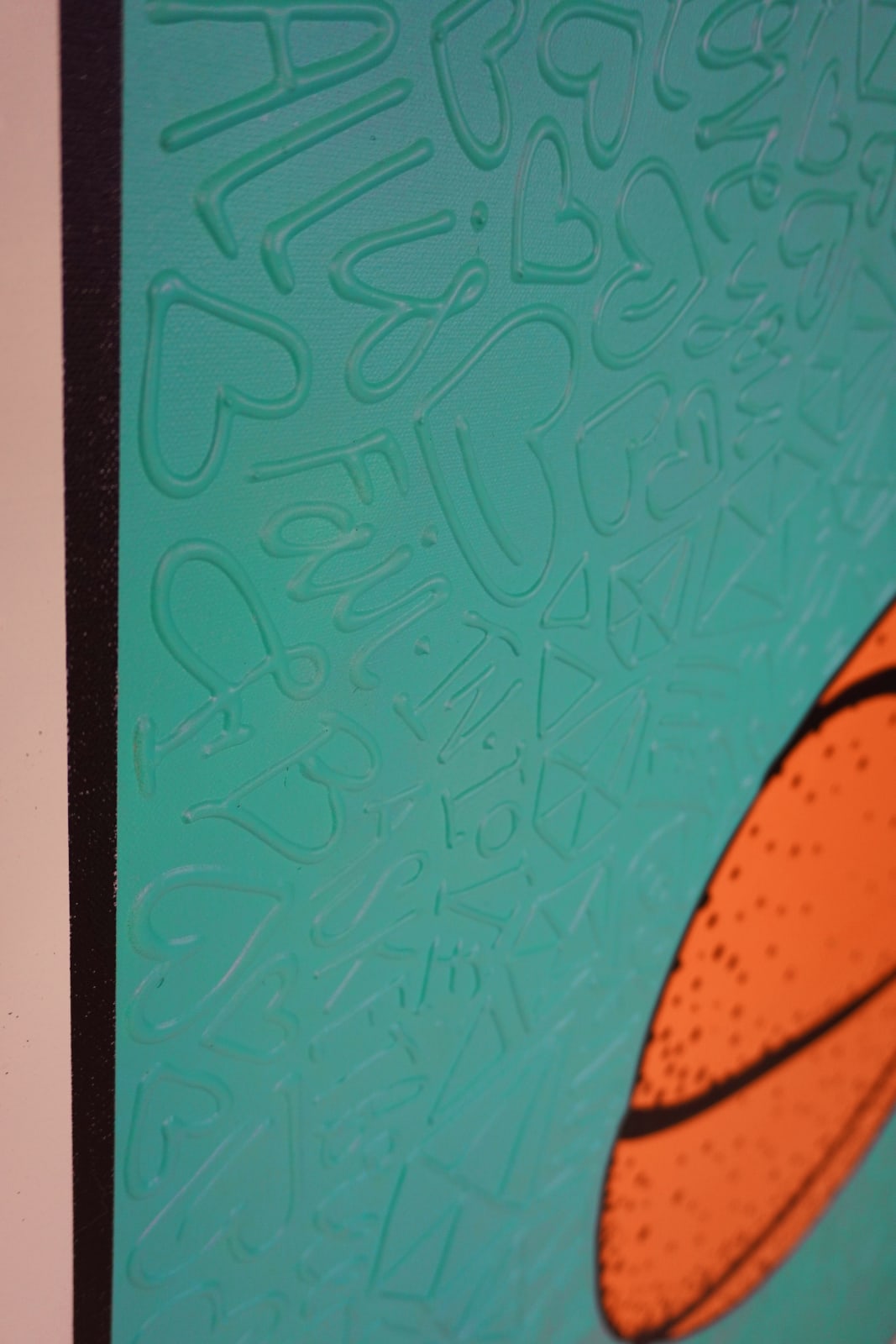 Detail photo of “El Balón”, painting by Cayla Birk artist from South Florida. Available at Carousel Fine Art Chicago. The artist’s technique blends traditional acrylic paints with unique materials, creating a distinct mixed media style. Birk's work is marked by intricate designs and recognizable gestures, combining contemporary culture, history, music, and literature. Her art challenges conventional thinking, offering new and unexpected experiences. Colors of this work : Teal, Orange, Beige, Black