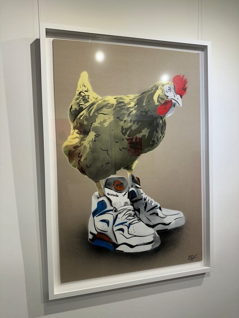 “Chicken at the Top Reebok (Yellow)”, mixed media work on recycled card stock by BYC artist, from Switzerland. Available at Carousel Fine Art Atlanta