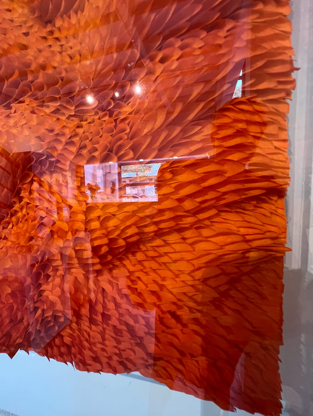 Detail photo of “Ocean #14”, sculptural paper work by Javier Leon Perez, artist from Spain. Available at Carousel Fine Art Miami. The artist’s technique uses Japanese paper with ink and pigment paint in an acrylic box to explore forms, light, and folds. This approach offers a personal expression that invites viewers to listen to their own thoughts and immerse themselves in a sensory journey. Colors of this work : Yellow, Orange