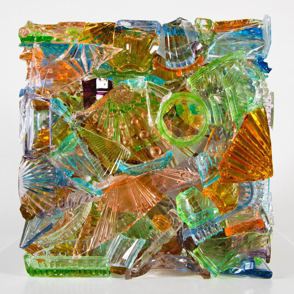 “I Have A Little Crush”, sculpture by Sandra Sashou. Sculpture is made from reassembled broken pieces of glass that are Art Deco Vanity Sets. The multicolor glass appears almost as sea glass with vibrant colors of green, lime green, turquoise, orange, cerulean and light rosy pink. Available at Carousel Fine Art Miami.